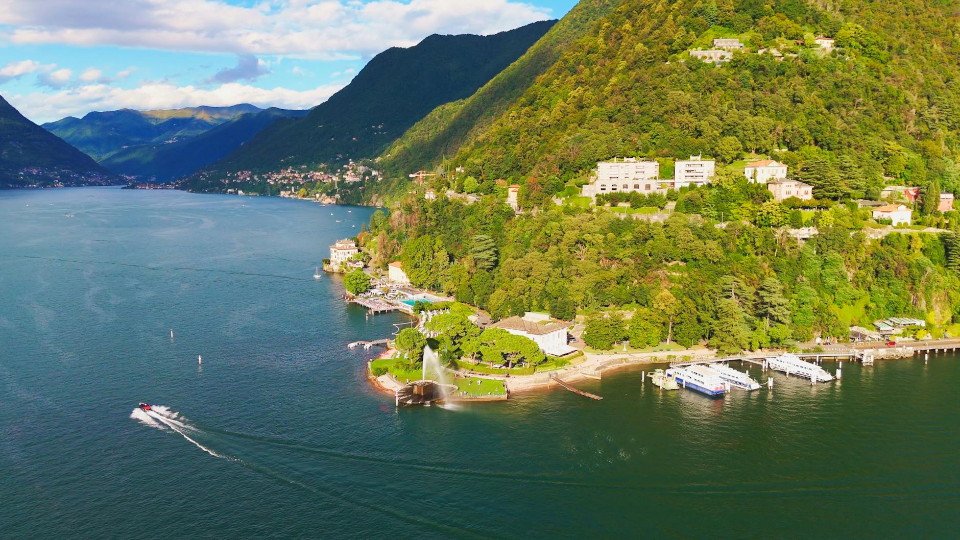 A stunning aerial view of Lake Como, Italy, with lush greenery and vibrant waters.