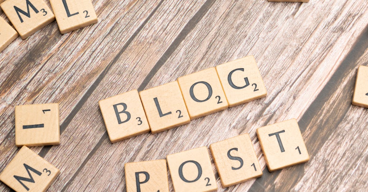 Wooden letter tiles spelling 'Blog Post' on a wooden background, ideal for online media concepts.