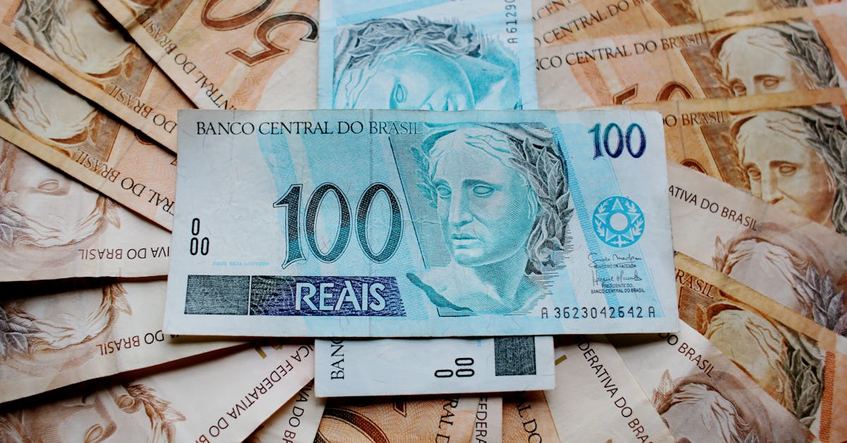 Close-up of Brazilian Real banknotes featuring different denominations and intricate designs.