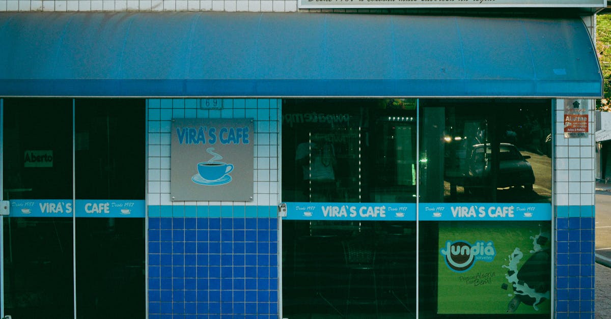 A cozy street view of Vira's Café featuring a distinctive blue tiled facade.
