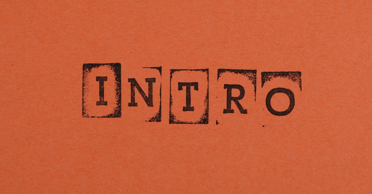 Close-up of the word INTRO stamped in black on an orange background, conveying a bold entrance.