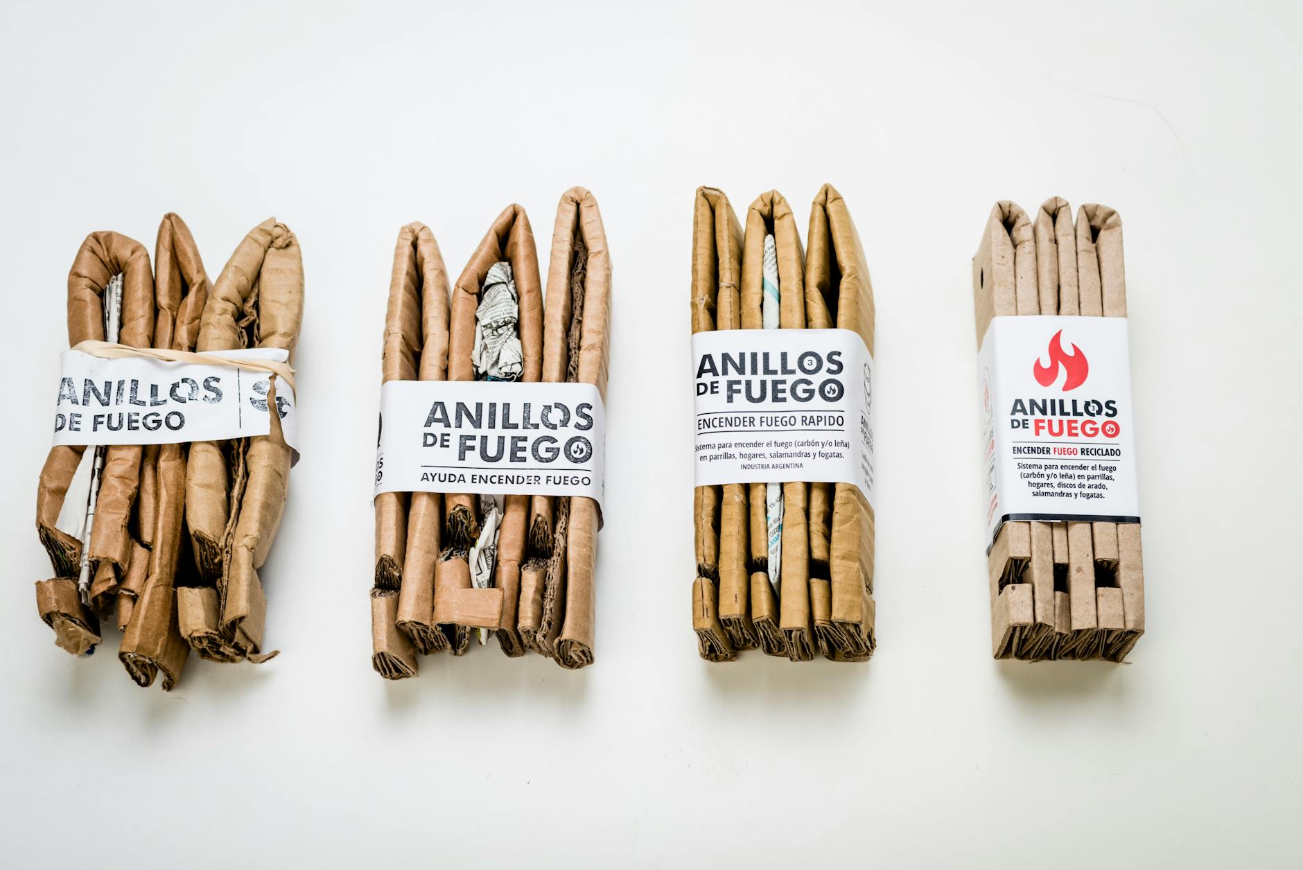 Close-up of various Anillos de Fuego fire starters on a white background, ideal for quick lighting.
