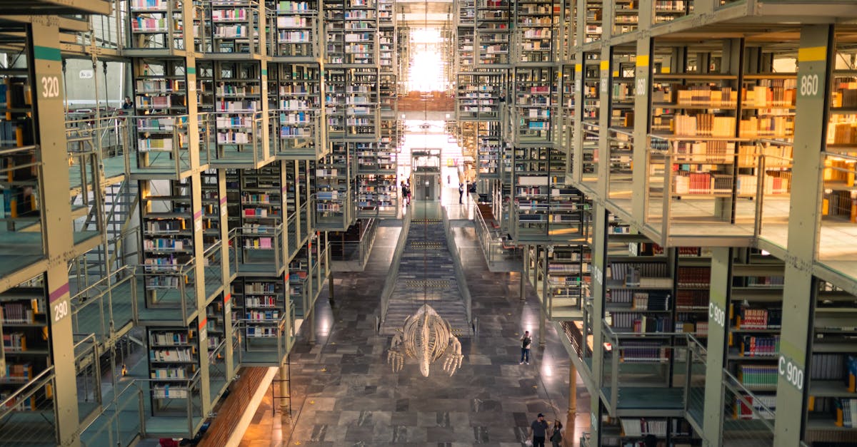 Spacious interior of Biblioteca Vasconcelos with towering bookshelves and modern architecture.