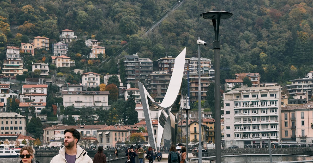 Pedestrians enjoying a walk on a footbridge in picturesque Lake Como, Italy.