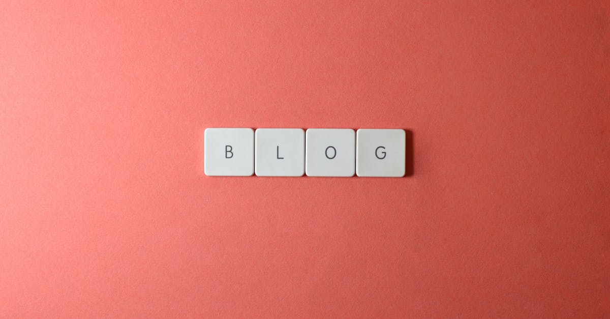 A minimalist image of keyboard keys spelling 'BLOG' on a coral background.